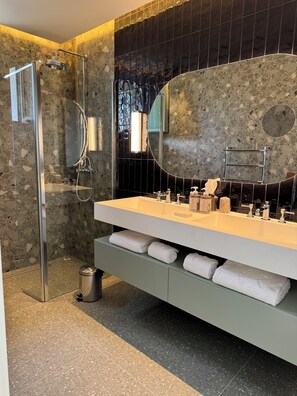 Shower, hair dryer, slippers, towels