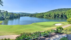A golf course with a lake, surrounded by forested hills. - Serenity Now: Big Canoe Mountain Home! (Jasper)