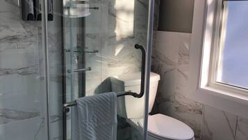 Shower, hair dryer, towels, soap