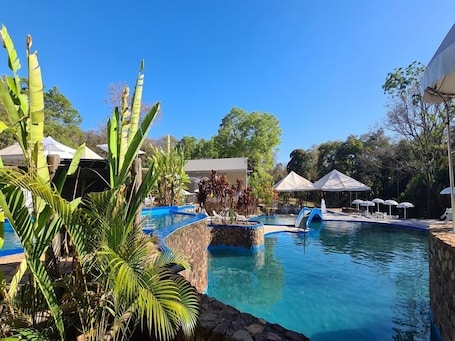 Indoor pool, 3 outdoor pools, open 9:00 AM to 10:00 PM, pool umbrellas. Itiquira Park Hotel
