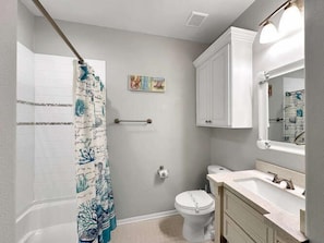 Shower, hair dryer, towels, shampoo