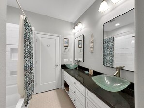 Shower, hair dryer, towels, shampoo