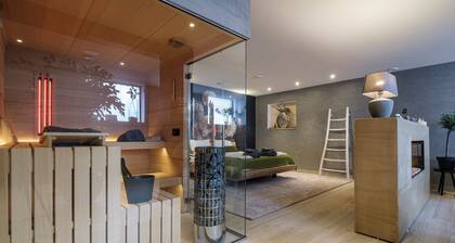 Relax in Wellness Room with Sauna and Spa Bath and luxurious outdoor seating.