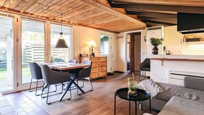 A modern kitchen with wooden cabinets and a built-in oven. - 4 Star Holiday Home in Hals (Hals)