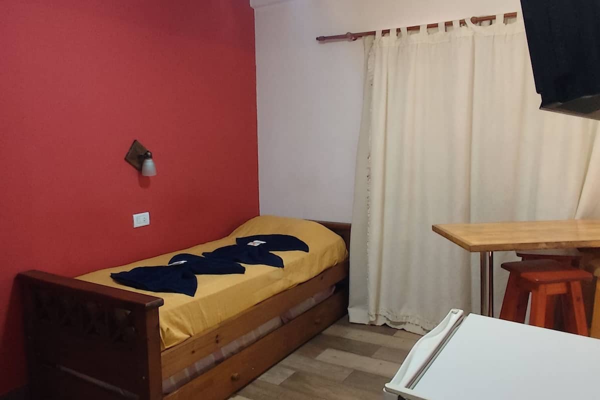 Superior Triple Room | Living area | TV