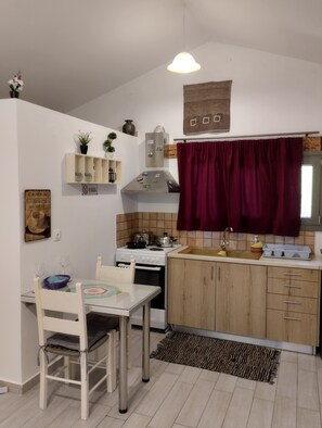 Fridge, microwave, oven, stovetop - olea cottage, a peaceful retreat in an olive grove in Galatas. (Galatas, Chania)