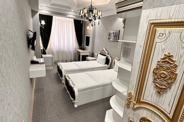 Habitación Deluxe con 1 cama doble o 2 individuales, vistas al patio | Sistema de insonorización