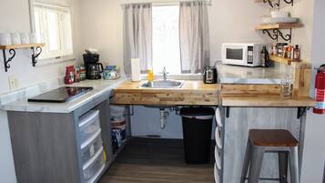 Fridge, microwave, stovetop, coffee/tea maker