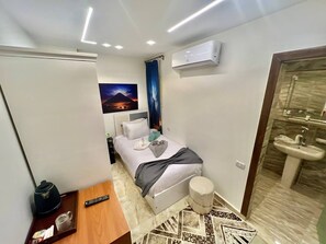 Standard Single Room | Minibar, blackout drapes, soundproofing, iron/ironing board