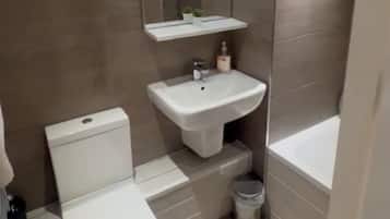 Hair dryer, towels, soap, toilet paper