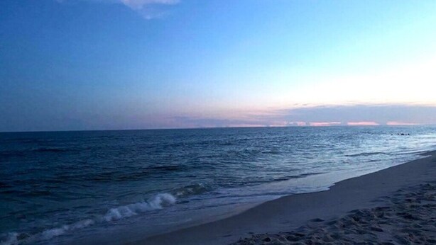 A beach with a clear sky and calm sea. - Dances with Waves - Villagio C245 Condo in Beautiful Perdido Key, FL (Pensacola)