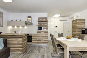 Appartement | Cuisine privée | Chaise haute