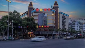 A hotel with a prominent sign reading "Hotel 8" and a large, illuminated entrance.