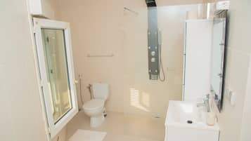 Shower, hair dryer, towels, soap