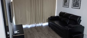 Charming 2-bedroom apartment with WiFi and fitness room in vibrant Santiago