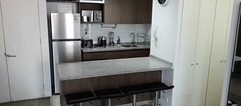 Charming 2-bedroom apartment with WiFi and fitness room in vibrant Santiago