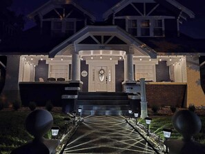 A house with a welcoming entrance, a visible number '20' on the door, and a pathway leading to the front door. - The Park House  A 5 Bedroom Retreat w/Game Room & (Huntington)