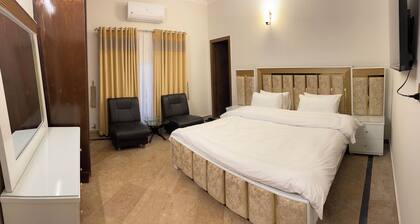 9 Bed Rooms House Featuring stunning mountain view with lush green lawn.