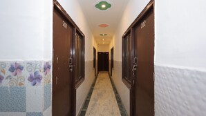 A hallway with doors numbered 207 and 202, leading to rooms. - Hotel ZoVo Agra (Agra)