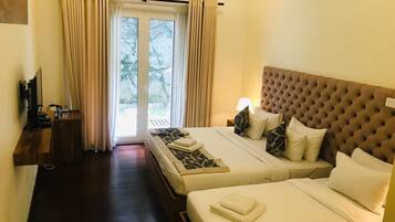 Standard Triple Room, Courtyard View | Desk, laptop workspace, iron/ironing board