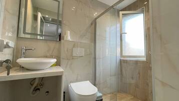 Hair dryer, towels, soap, shampoo