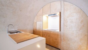 A modern bathroom with a wooden vanity, a sink, and a mirror. - Charming semi-troglodyte house, Amboise (Amboise)