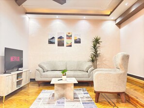 Apartment, City View | Living area | 43-inch flat-screen TV with satellite channels, Smart TV, Netflix - Joy Homes Mohandeseen - Families only (Giza)