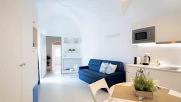 Deluxe Apartment, City View | Living area | 42-inch Smart TV with satellite channels