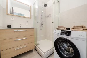 Shower, hair dryer, towels, toilet paper