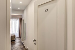 Deluxe Room, City View | In-room safe, desk, laptop workspace, blackout drapes