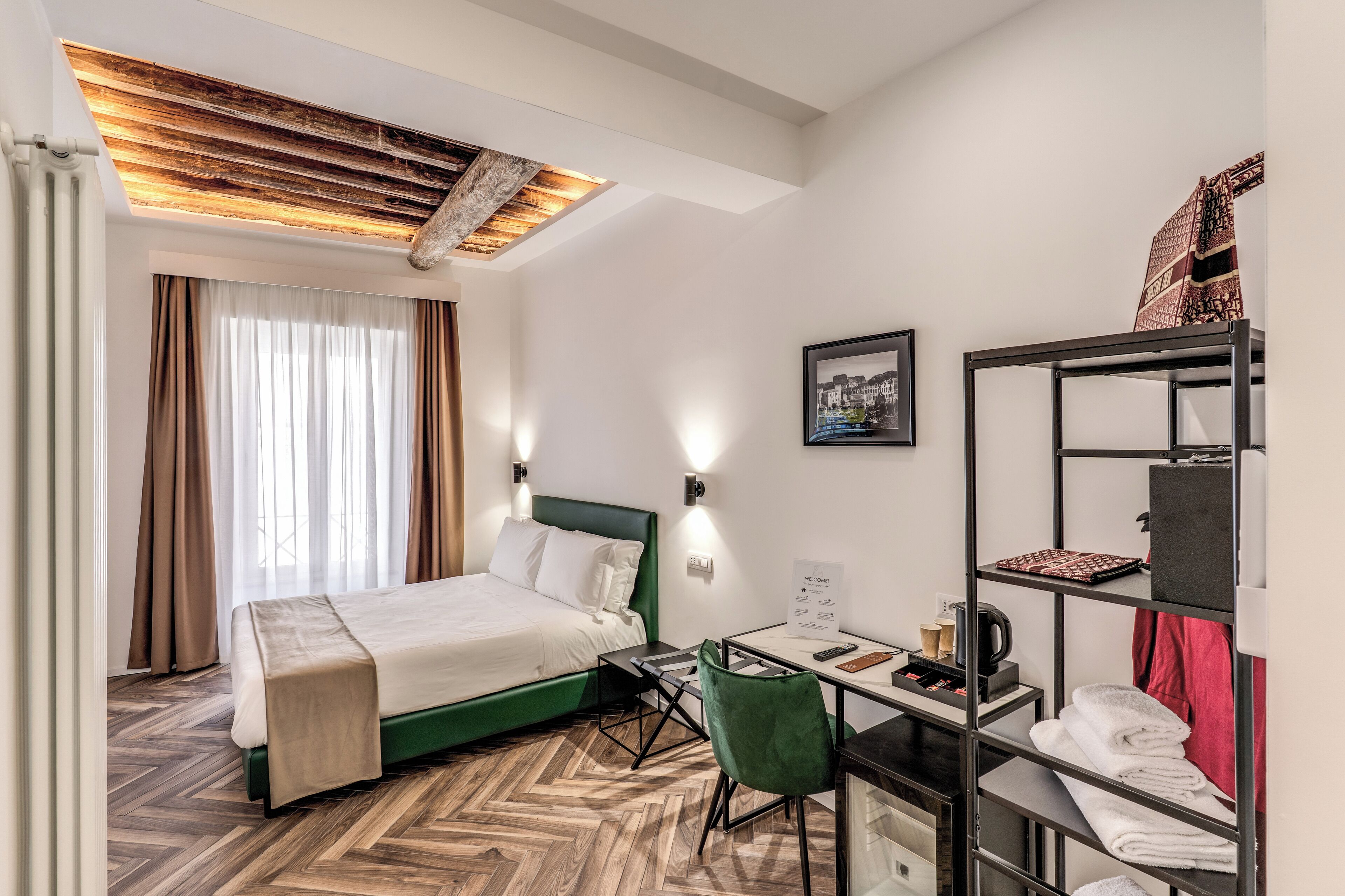 Deluxe Room, City View | In-room safe, desk, laptop workspace, blackout drapes