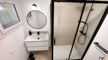 Shower, hair dryer, towels, toilet paper