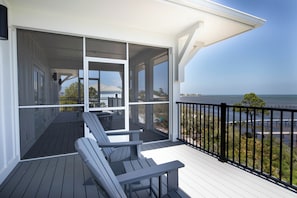 Terrace/patio - Bayfront oasis with private dock, pool, elevator and easy ADA beach access. (Port St Joe)