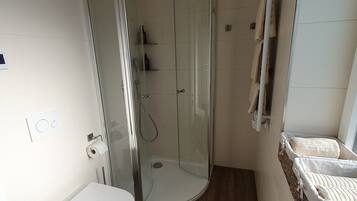 Shower, hair dryer, towels, soap