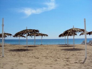 On the beach, sun loungers, beach towels