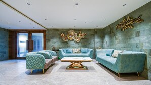 A modern living room with a sectional sofa, a matching armchair, and a coffee table.