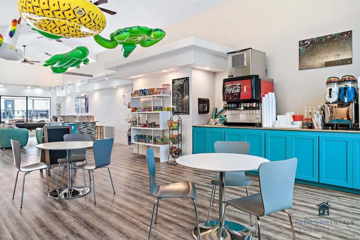 A modern interior with a bar area, seating, and a coffee machine.