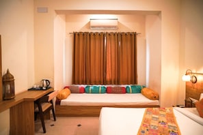 Desk, laptop workspace, bed sheets