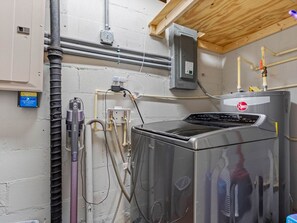 Beyond the walk in closets is the laundry room