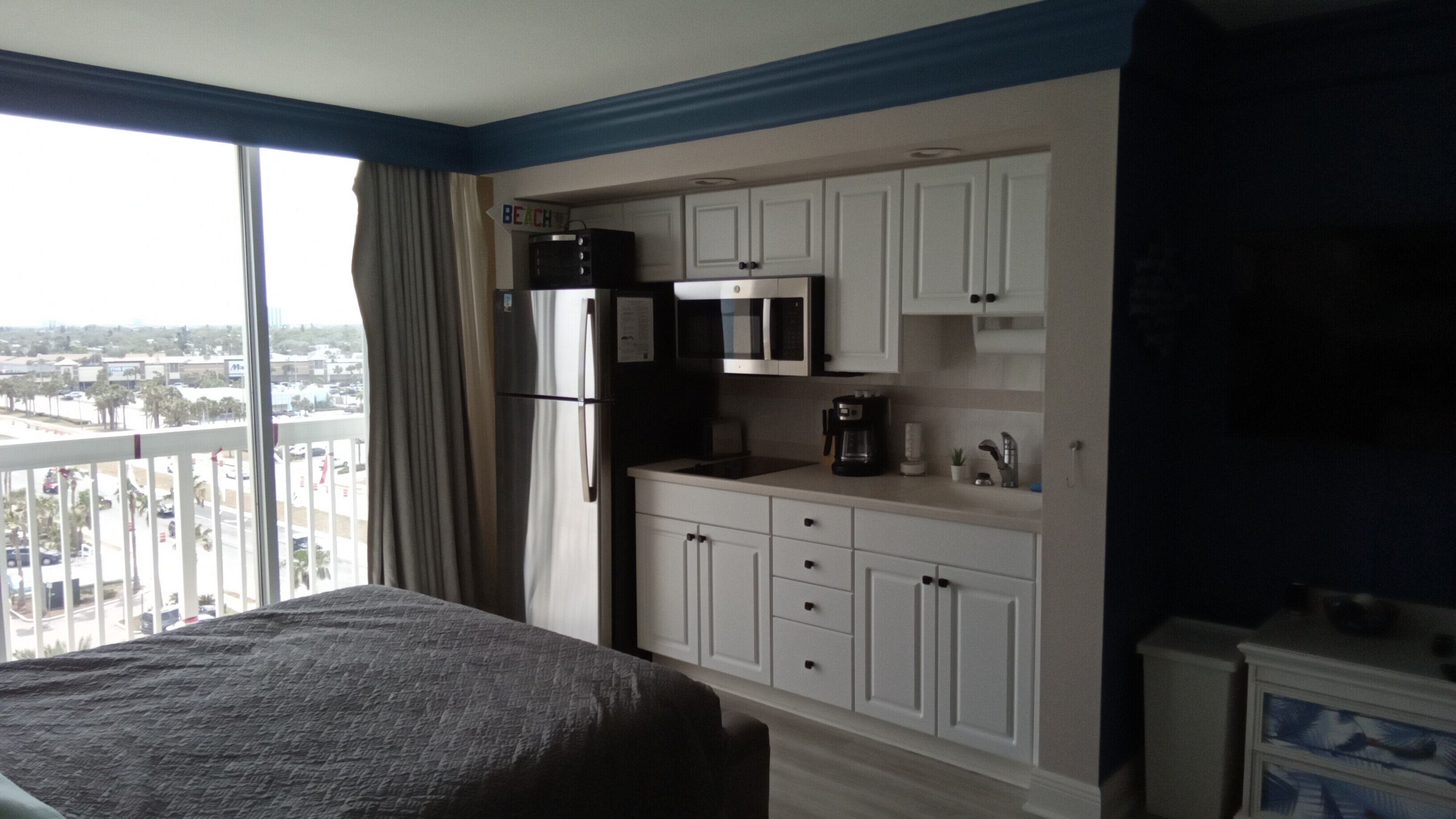 Fridge, microwave, stovetop, coffee/tea maker