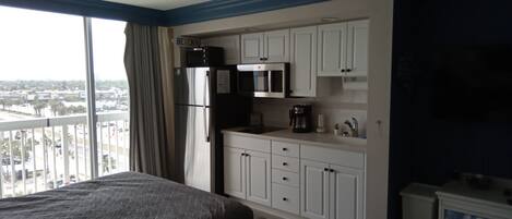 Fridge, microwave, stovetop, coffee/tea maker