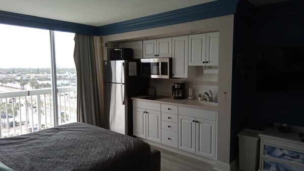 Fridge, microwave, stovetop, coffee/tea maker