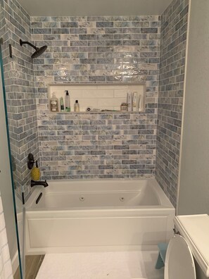 Shower, jetted tub, hair dryer, towels