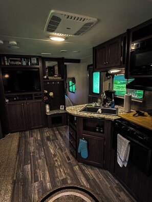 Fridge, microwave, stovetop, coffee/tea maker