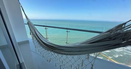 Charming 2-bedroom apartment in front of the Beach with WiFi, AC, Pool, Jacuzzi