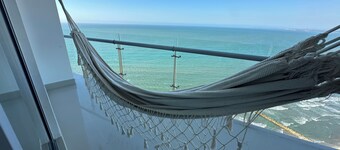 Charming 2-bedroom apartment in front of the Beach with WiFi, AC, Pool, Jacuzzi