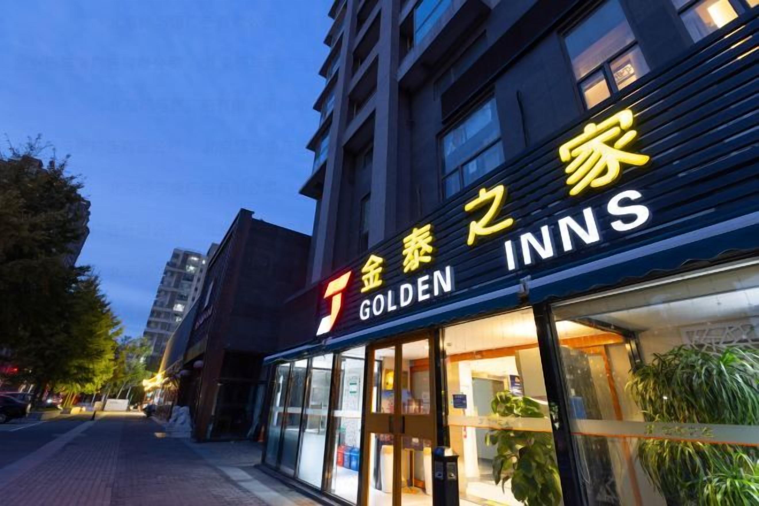 A hotel named 'Golden Inns' with a visible entrance and signage.