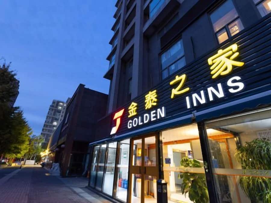 A hotel named 'Golden Inns' with a visible entrance and signage.