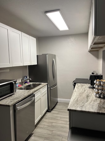 Fridge, microwave, oven, stovetop. PROMO NOW: City and Stadium Sanctuary Vibes