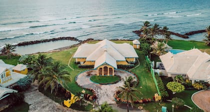 Ocean front luxury villa in gated golf course community with private beach.